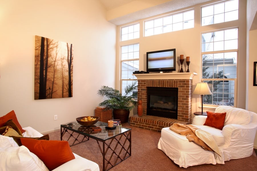 Remodeled living room, after with a Colorado fireplace. Agents for Home Buyers says that fireplaces are popular features in Colorado.